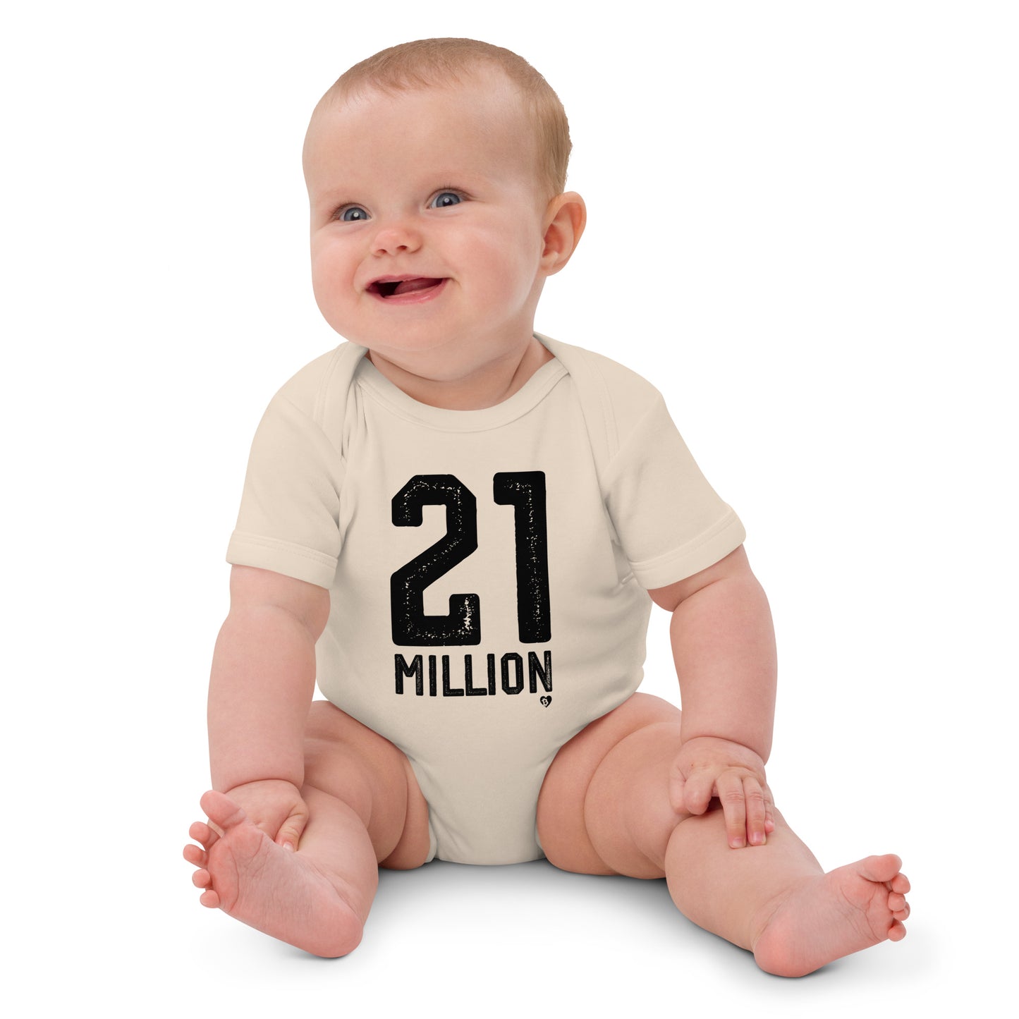 Baby wearing a onesie with '21 MILLION' print on a white background