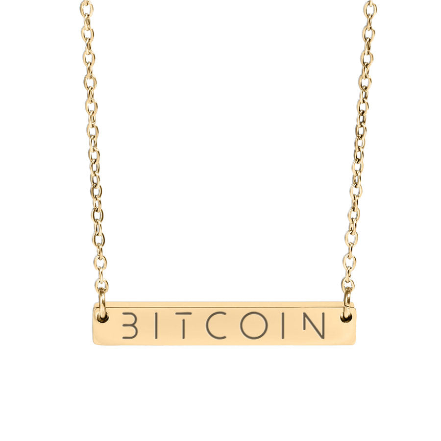 Gold necklace with 'BITCOIN' pendant on a white background