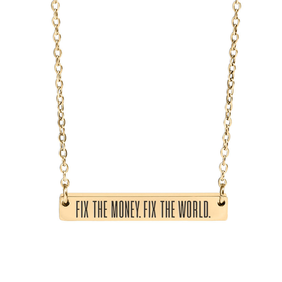 Gold necklace with bar pendant reading 'FIX THE MONEY. FIX THE WORLD.' on a white background