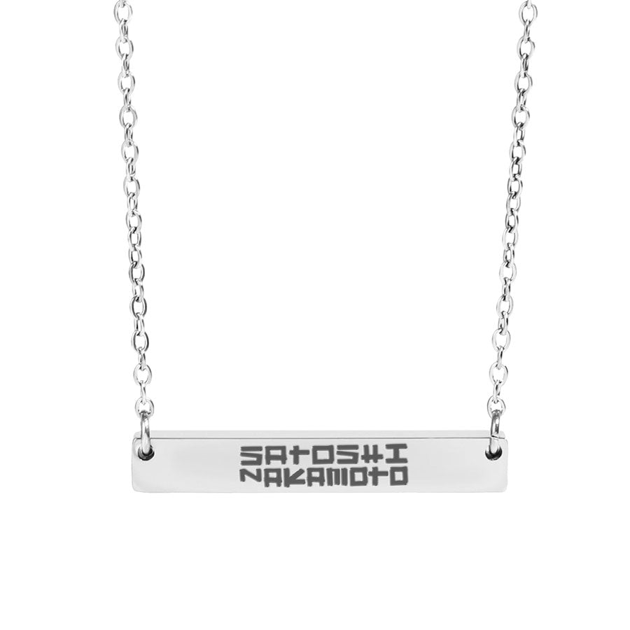 Silver necklace with a bar pendant engraved with 'Satoshi Nakamoto' on a white background