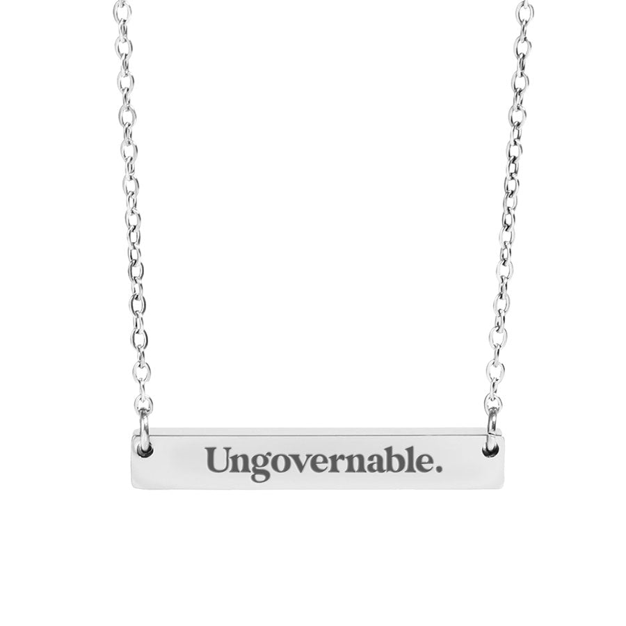 ungovernable opsec bitcoin pendant on a necklace