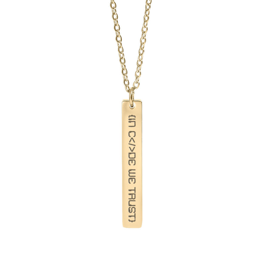 Gold necklace with a bar in code we trust pendant on a white background