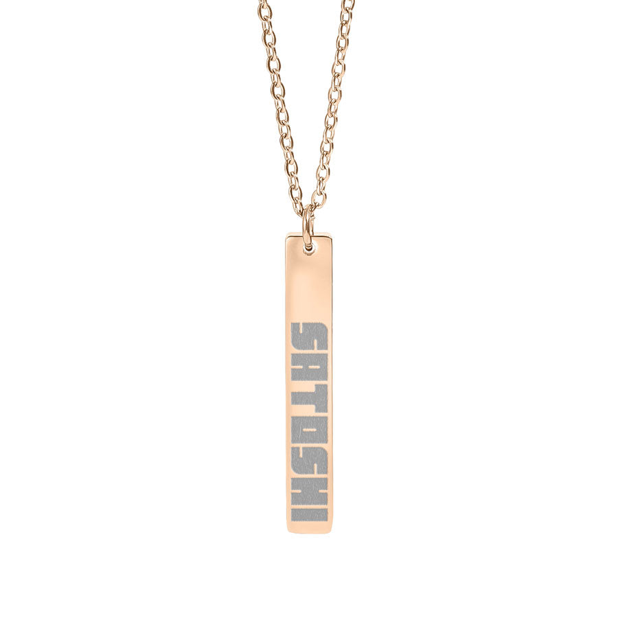 Rose gold necklace with a bar pendant saying satoshi on a white background
