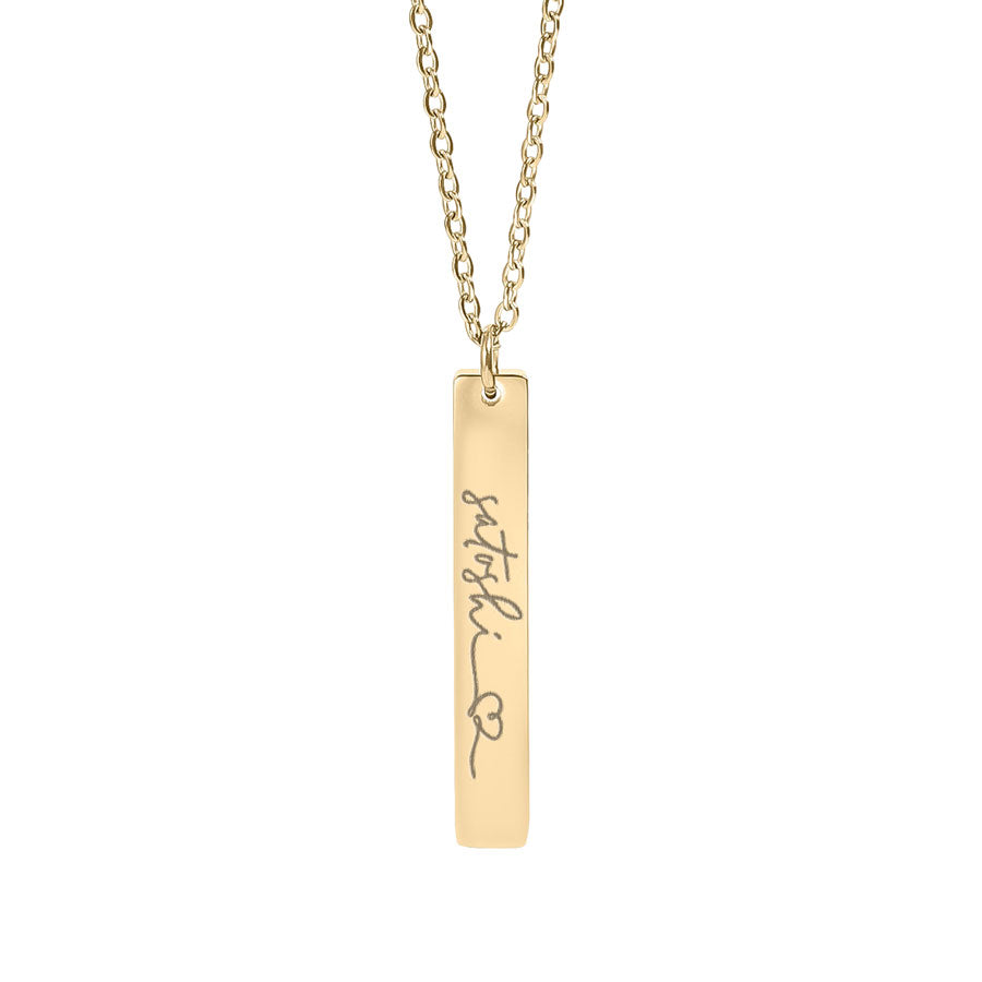 saatoshi Gold necklace with a bar pendant on a white background
