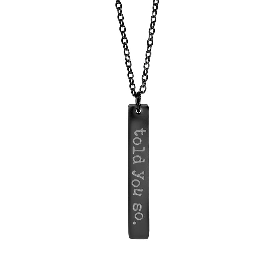 Black necklace with a bar pendant engraved with 'told you so.' on a white background