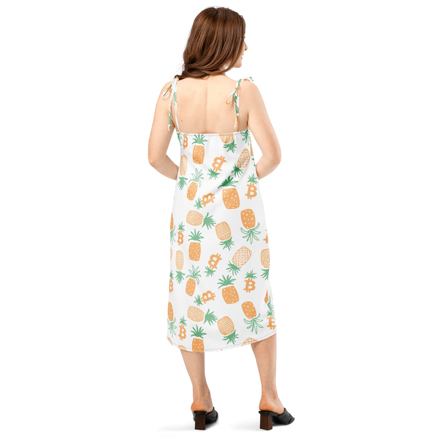 Woman wearing a white dress with pineapple bitcoin pattern on a white background