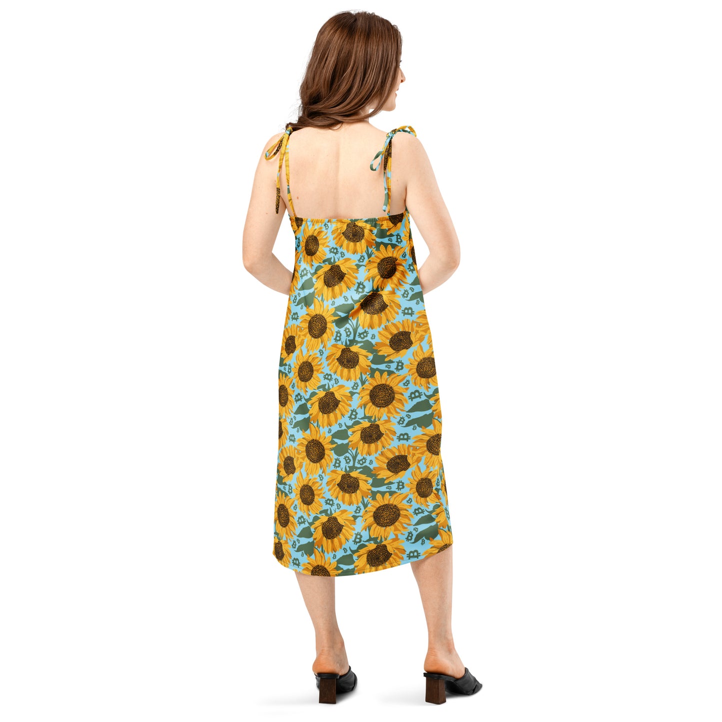 Woman wearing a sunflower bitcoin patterned dress on a white background