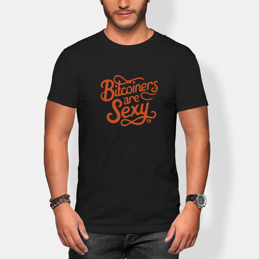 Person wearing a black t-shirt with 'Bitconers are Sexy' text in orange on a white background