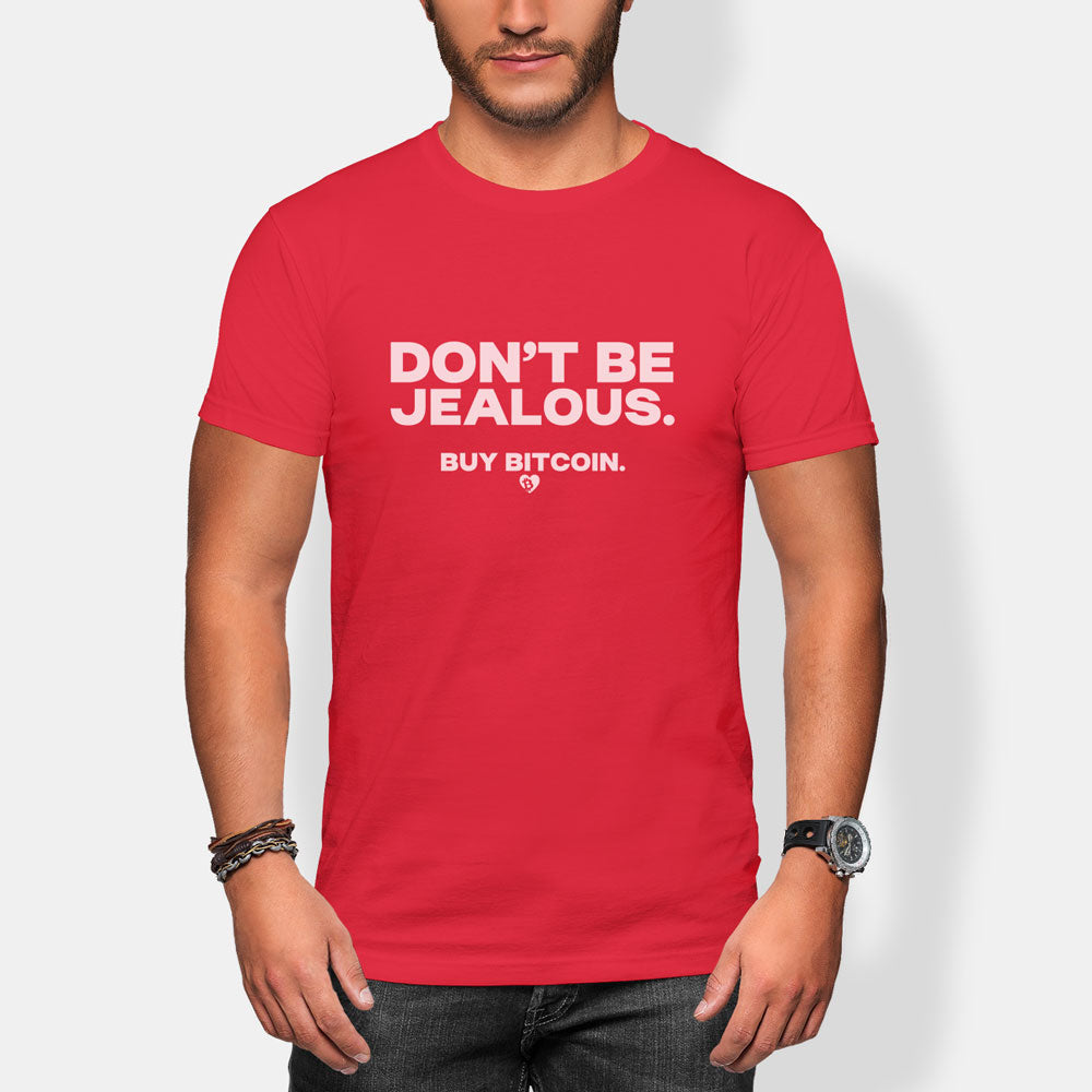 Red t-shirt with 'DON'T BE JEALOUS. BUY BITCOIN.' text worn by a person on a white background