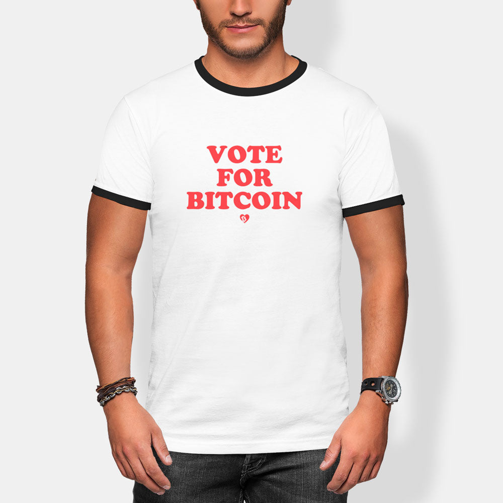 Person wearing a white t-shirt with 'Vote for Bitcoin' text on a plain background