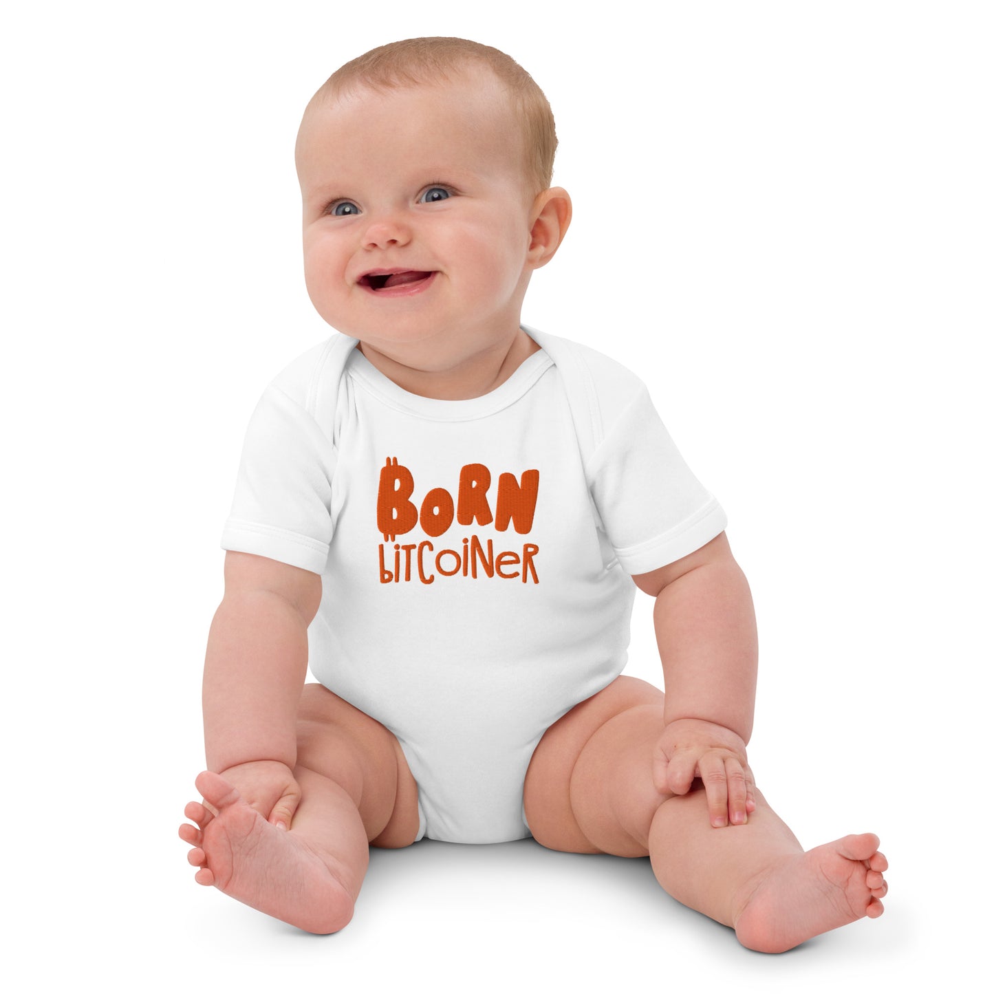 Baby wearing a white onesie with 'Born Bitcoiner' text on a white background