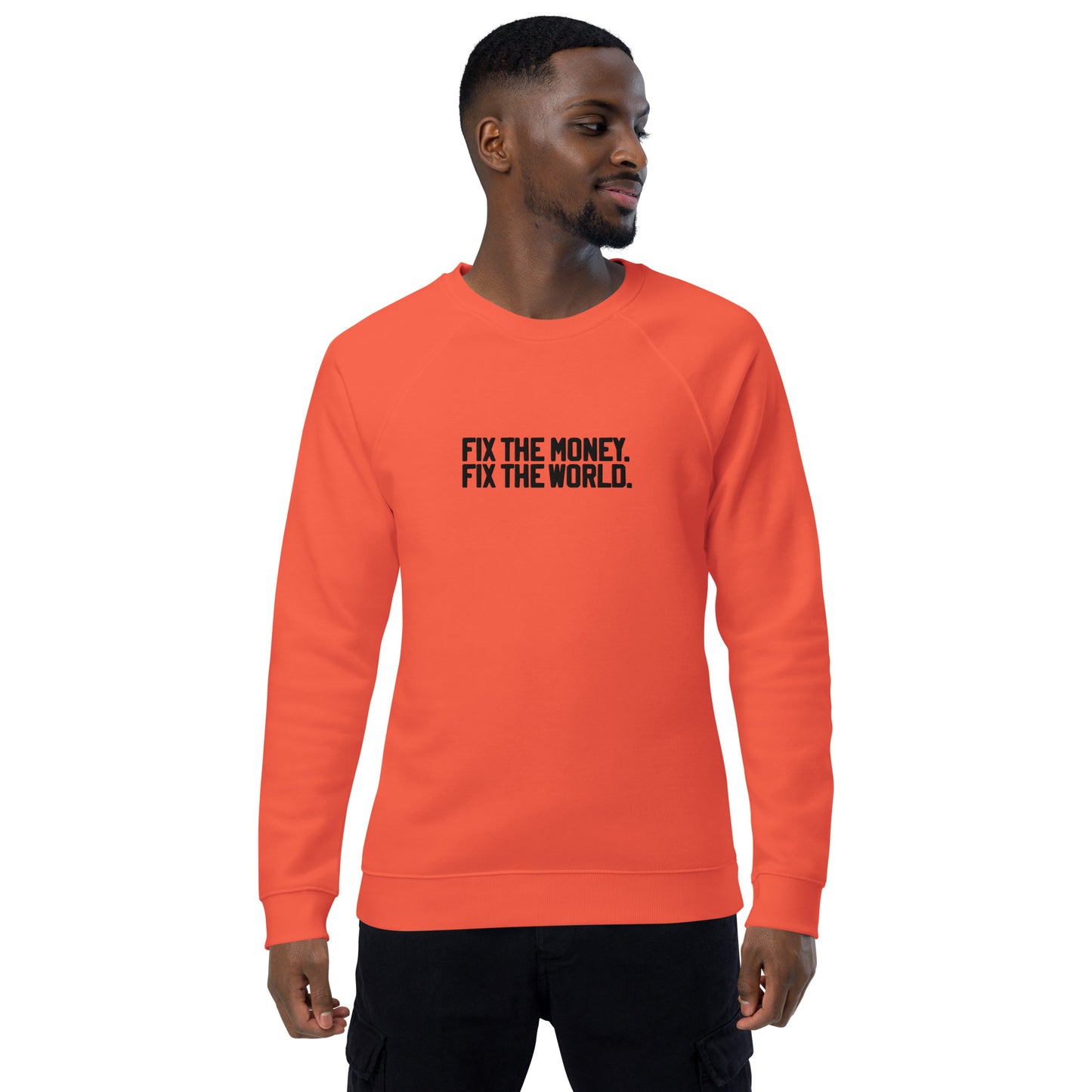 Man wearing an orange sweatshirt with fix the money. fix the world. text on a white background