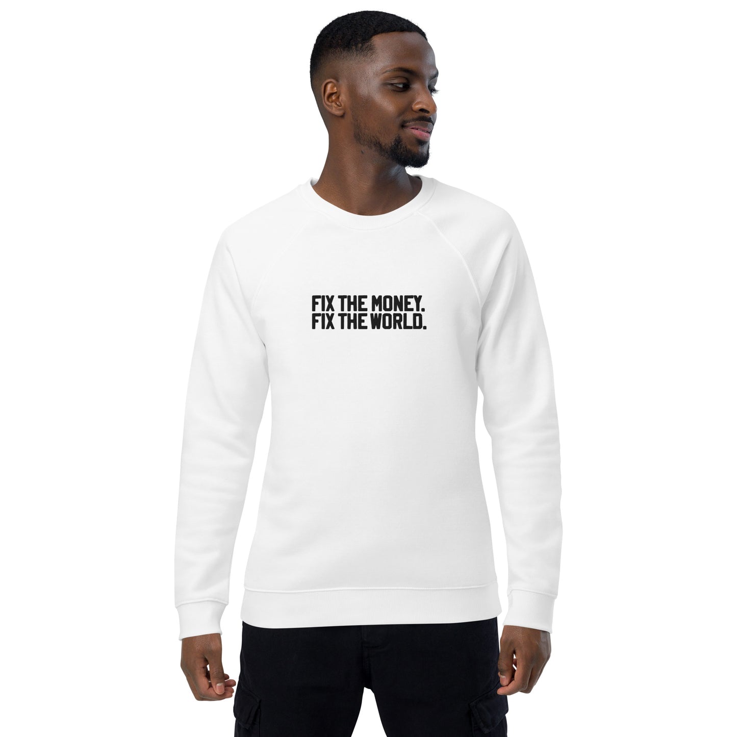 Man wearing a white sweatshirt with text 'FIX THE MONEY, FIX THE WORLD' on a white background