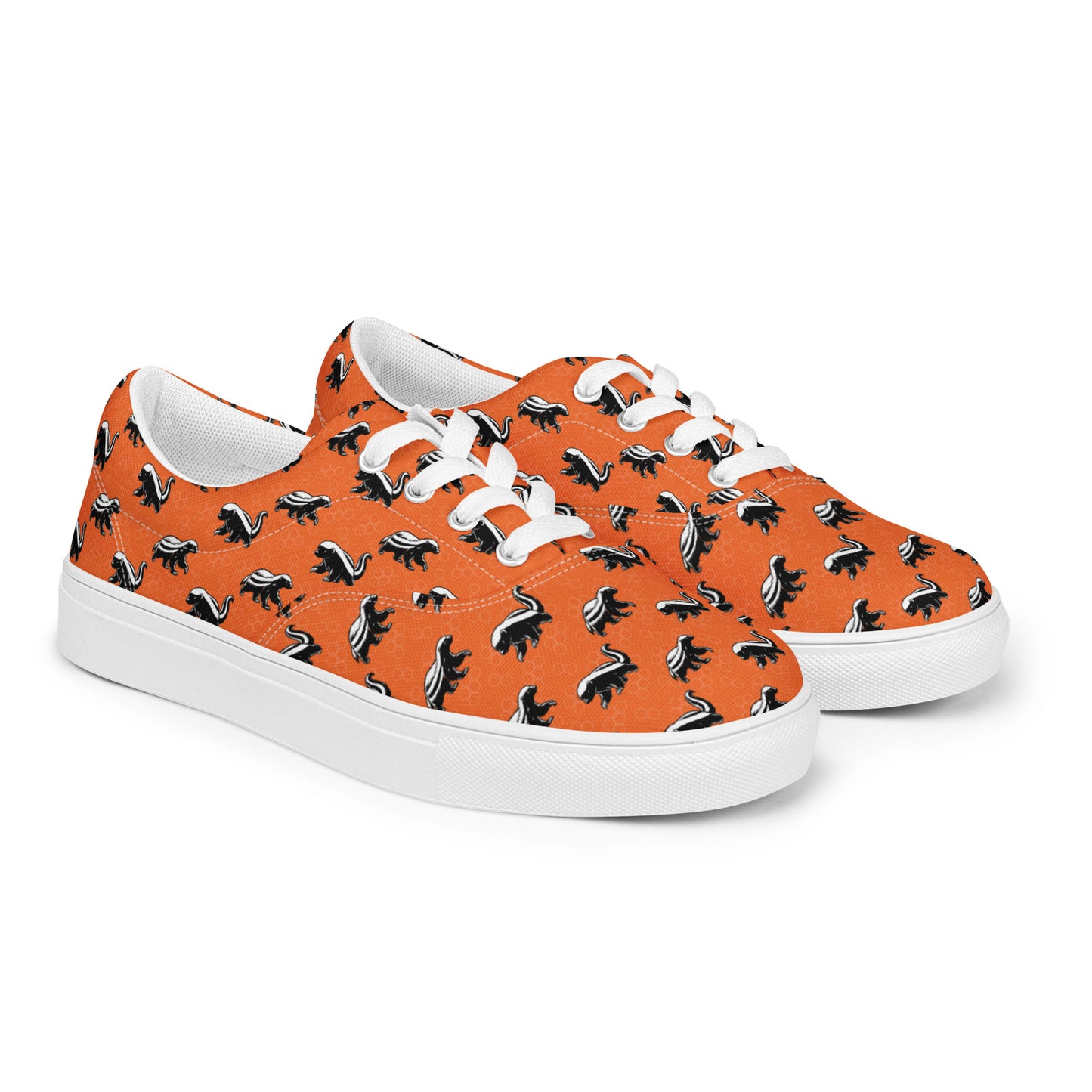 Orange sneakers with black and white honey badger pattern on a white background