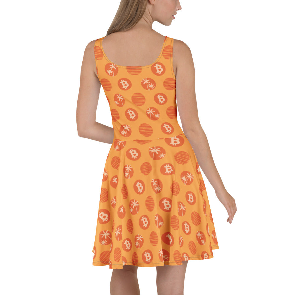Woman wearing an orange dress with Bitcoin tropical pattern on a white background