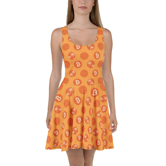 Orange dress with Bitcoin tropical pattern worn by a model on a white background