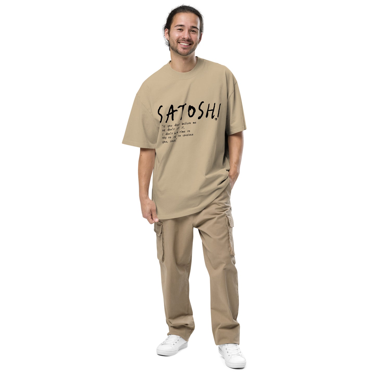 Man wearing a beige t-shirt with 'Satoshi' text on a white background