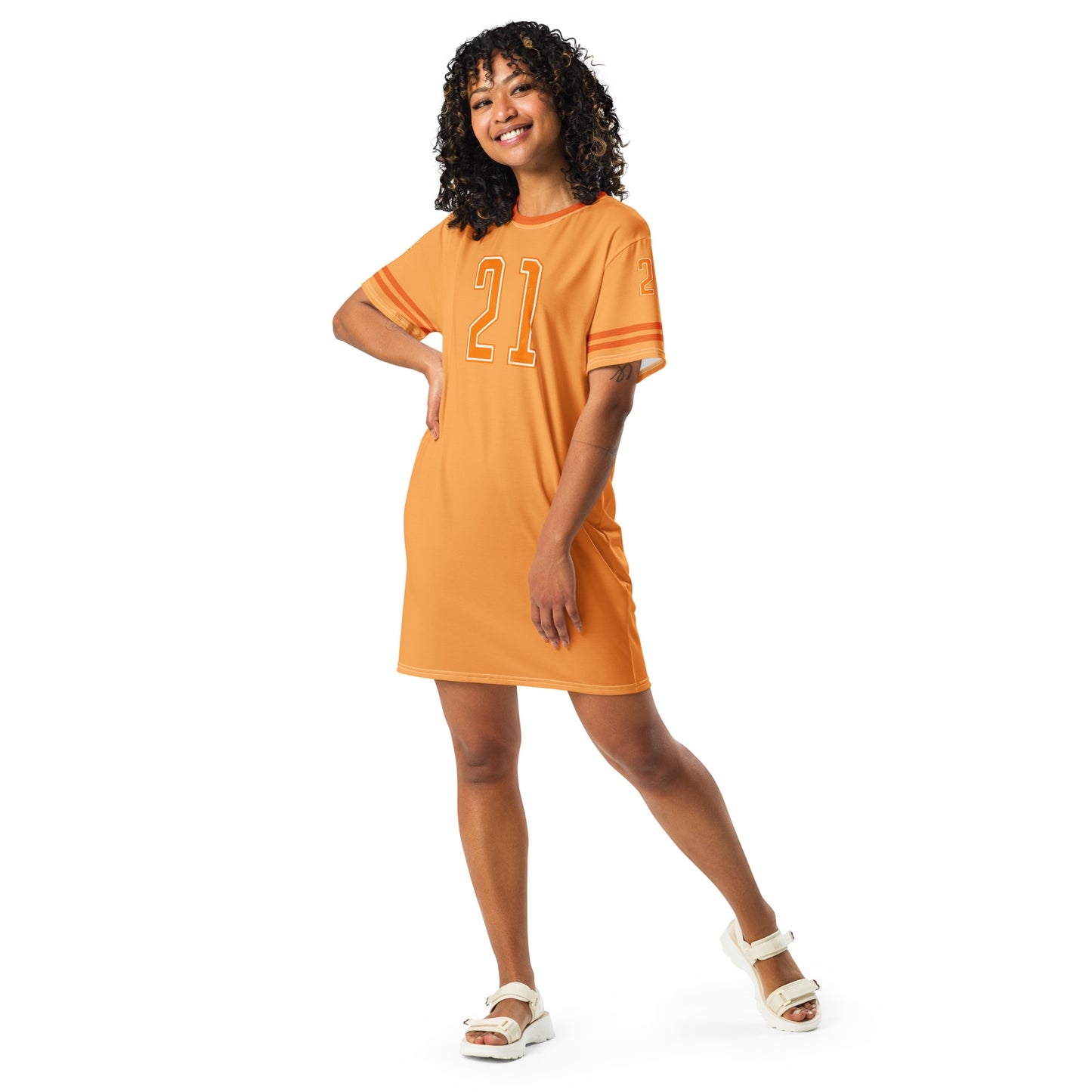 Woman wearing an orange dress with the number 21 on a white background