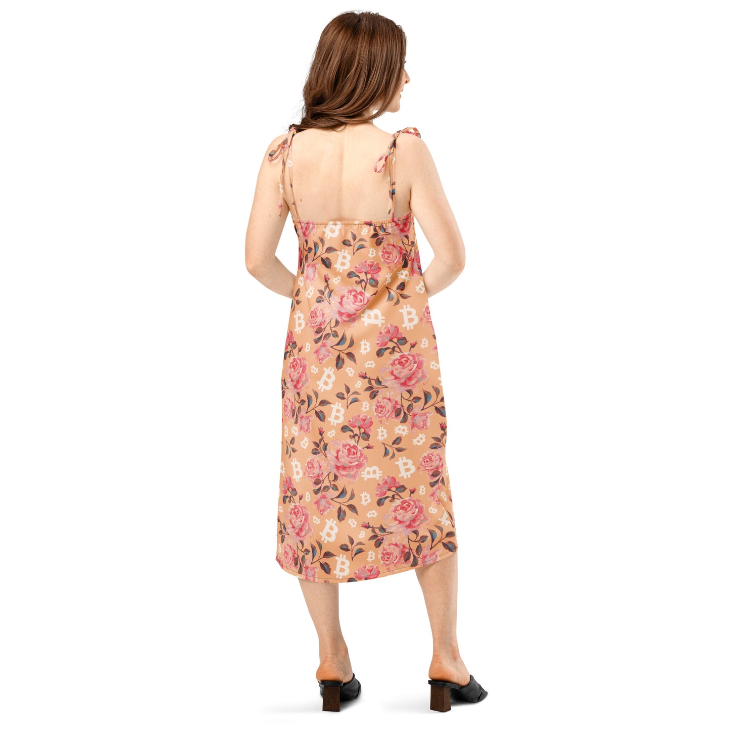 Woman wearing a floral bitcoin dress on a white background