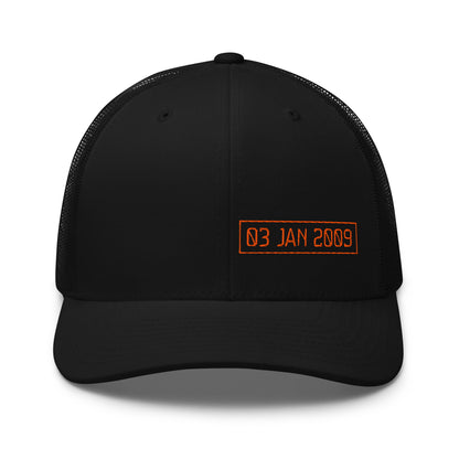 Black cap with orange text '03 JAN 2009' on a white background