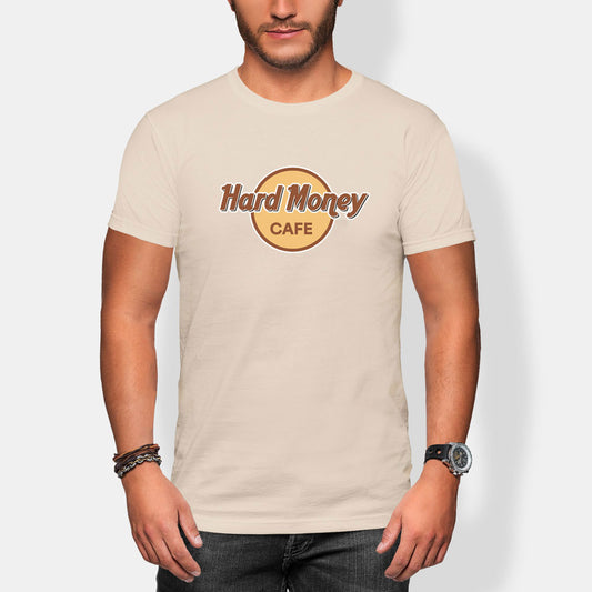 Person wearing a beige t-shirt with 'Hard Money Cafe' logo on a plain background