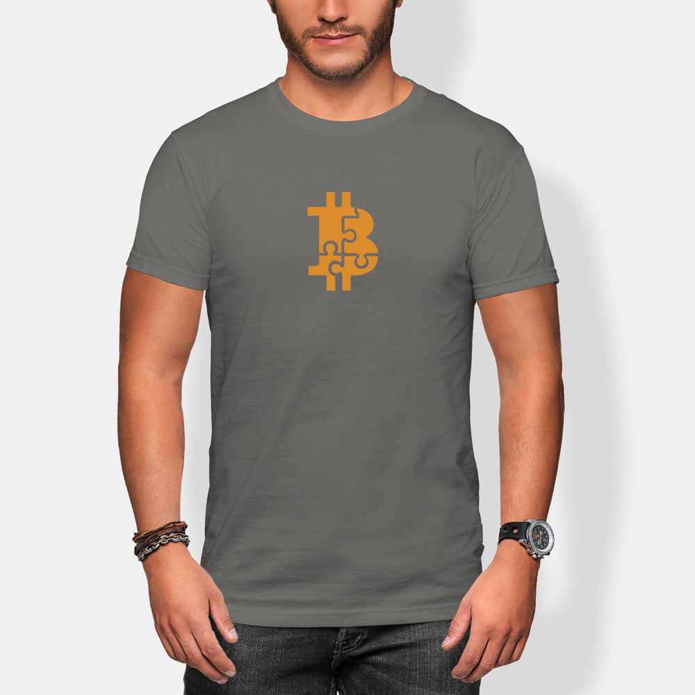 Person wearing a gray t-shirt with a Bitcoin puzzle symbol on a white background