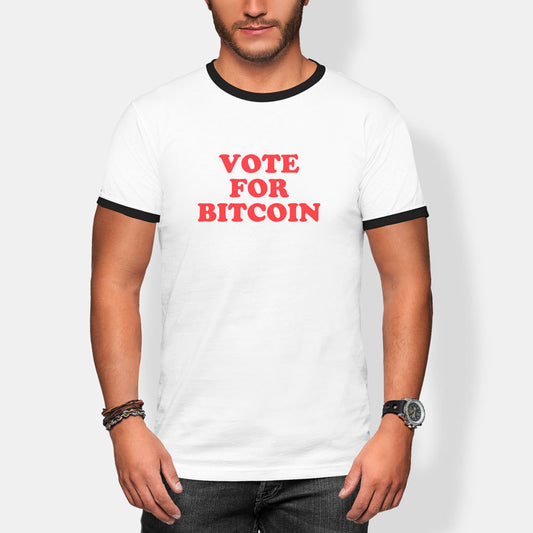 Person wearing a white t-shirt with 'Vote For Bitcoin' text on a plain background