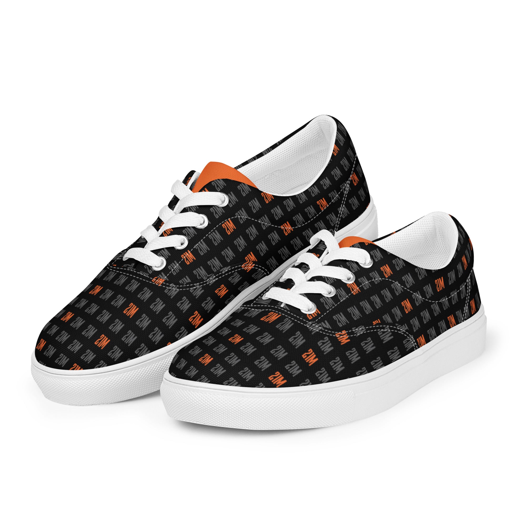 Black sneakers with orange 21 million pattern and white laces on a white background