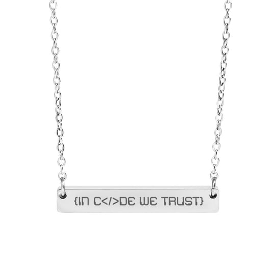 Silver necklace with 'IN Code WE TRUST' pendant on a white background