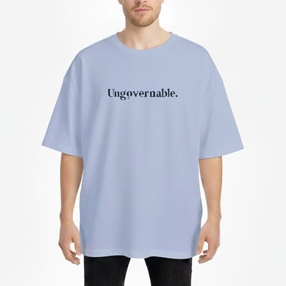 Person wearing a light blue t-shirt with 'Ungovernable.' text on a white background