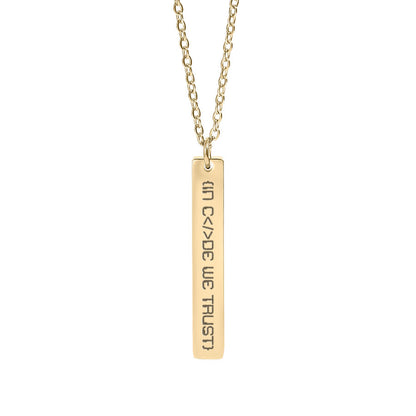 Gold necklace with a bar in code we trust pendant on a white background