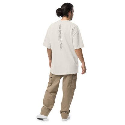 Person wearing a beige t-shirt with Bitcoin whitepaper doi on the back and beige cargo pants on a white background