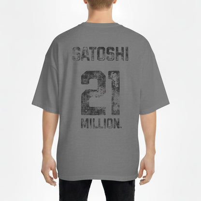 Person wearing a gray t-shirt with 'Satoshi 21 Million' text on the back