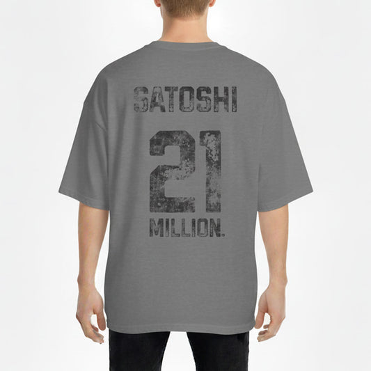 Person wearing a gray t-shirt with 'Satoshi 21 Million' text on the back