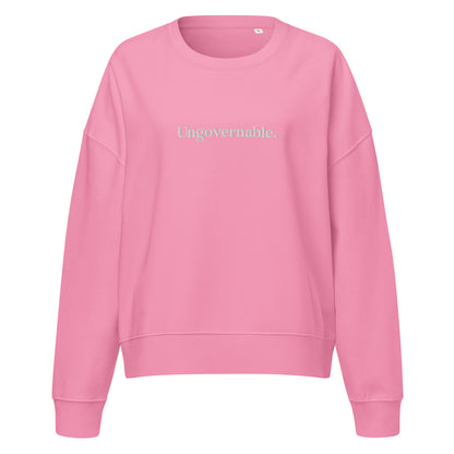 Pink sweatshirt with 'Un Governable' text on a white background