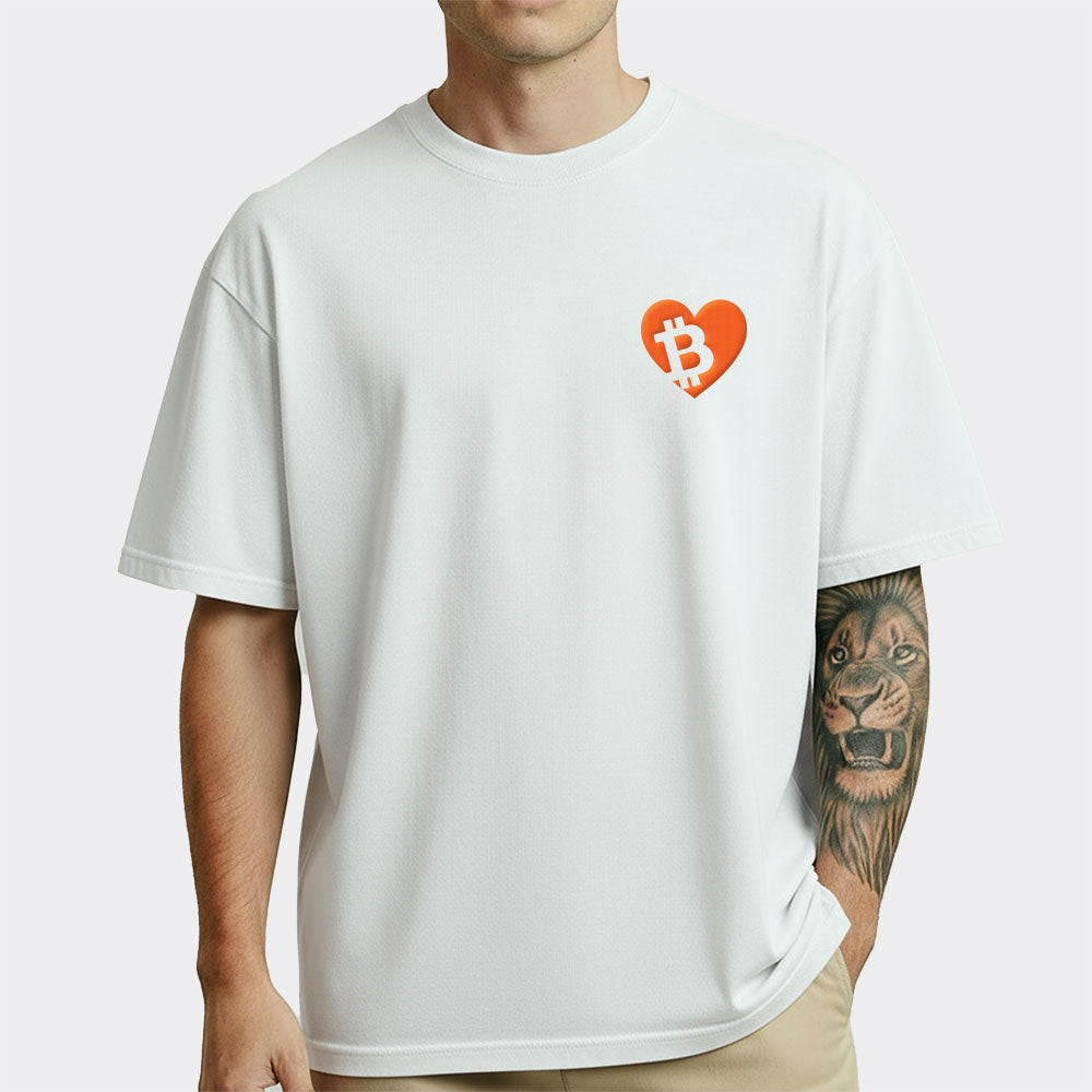 Person wearing a white t-shirt with a orange heart and Bitcoin symbol design.