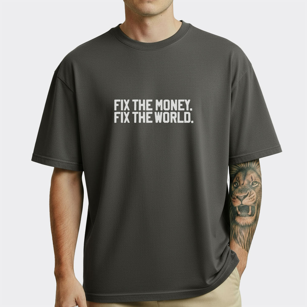 Person wearing a black t-shirt with 'FIX THE MONEY. FIX THE WORLD.' text on a white background