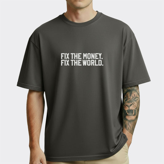 Person wearing a black t-shirt with 'FIX THE MONEY. FIX THE WORLD.' text on a white background