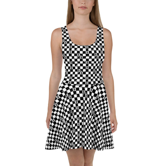 Black and white checkered dress with bitccoin logos worn by a model on a white background