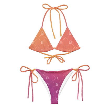 Two-piece bitcoin bikini set with orange and pink gradient design on a white background