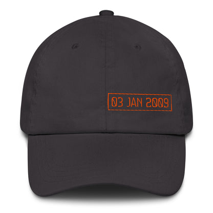 Black cap with orange text '03 JAN 2009' on a white background
