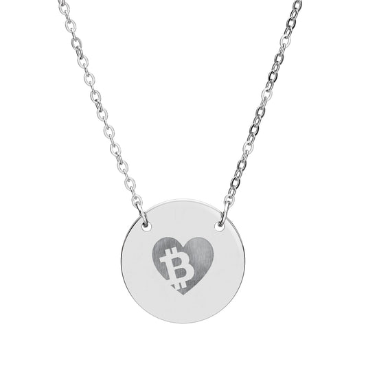 Silver necklace with a round pendant featuring a heart and Bitcoin symbol on a white background