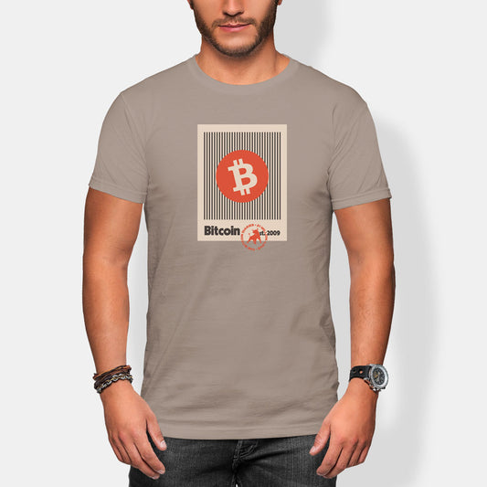 Person wearing a beige t-shirt with Bitcoin logo and text.