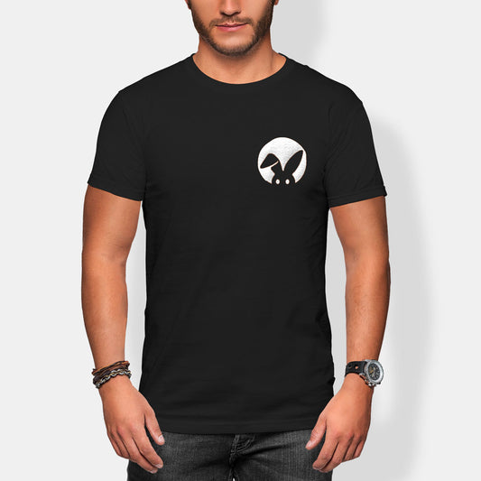 Person wearing a black t-shirt with a white rabbit logo on a plain background