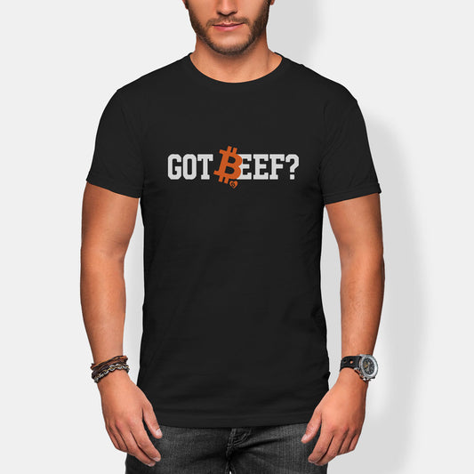 Person wearing a black t-shirt with bitcoin 'GOT BEEF?' text design.