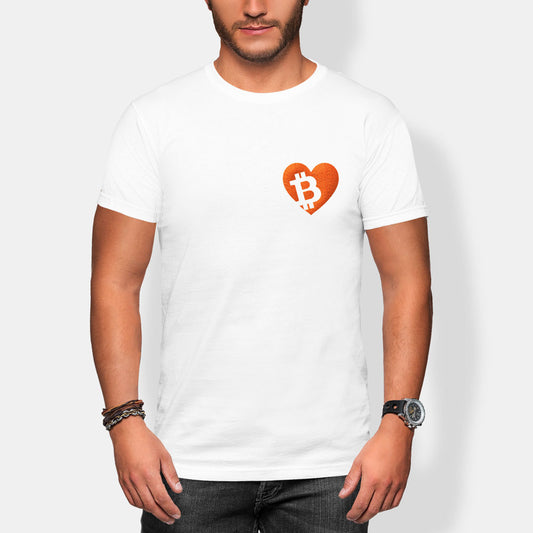 Person wearing a white t-shirt with a heart-shaped Bitcoin logo on a plain background