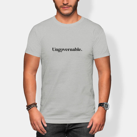 Person wearing a gray t-shirt with 'Ungovernable' text on a plain background