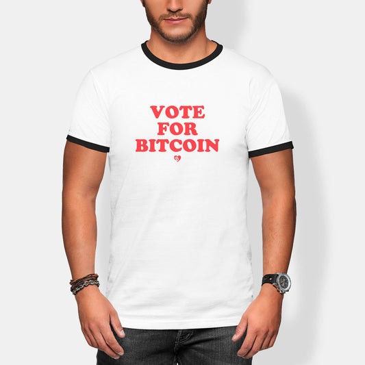 Person wearing a white t-shirt with 'Vote for Bitcoin' text on a plain background