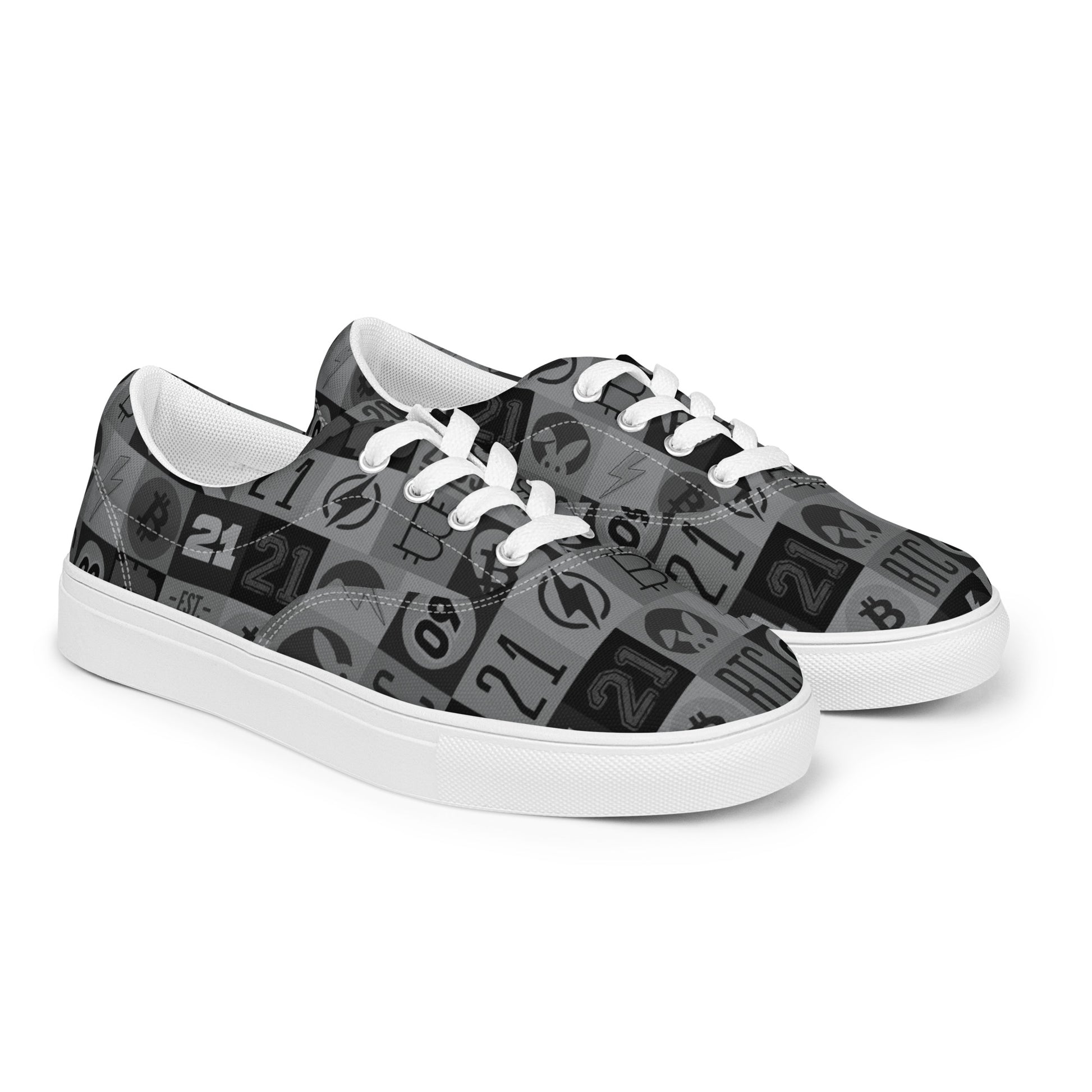 Pair of sneakers with black and gray bitcoin pattern on a white background