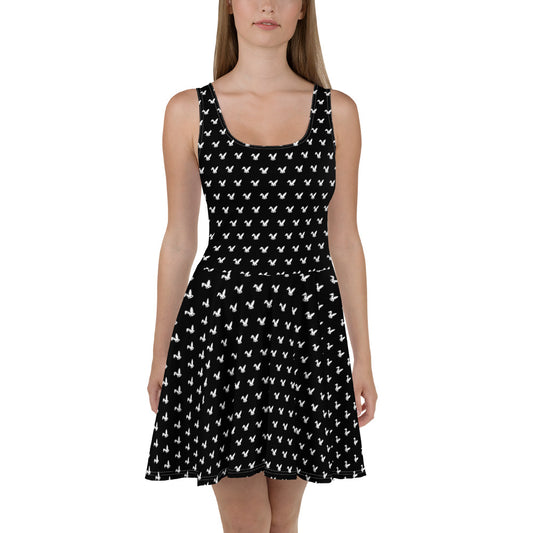 Black dress with white rabbit pattern worn by a model on a white background